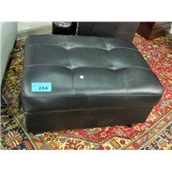 Black leather ottoman with under cushion storage