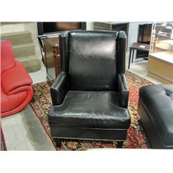 Black leather wing back chair