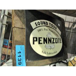 Penzoil tin advertisment sign on board