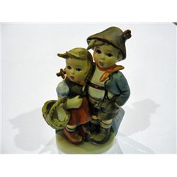 Hummel figurine; boy and girl with gathering