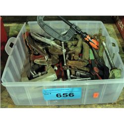 Clear plastic storage bin of assorted clamps
