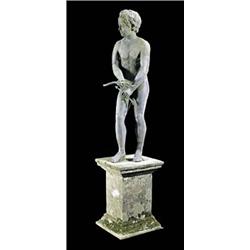 An early 19th century lead figure of a nude boy, in a relaxed pose, holding a small bow and arrow, o