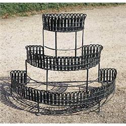 An early 20th century iron and wirework three tier jardiniere stand, of graduated, semi-circular for