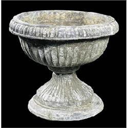 A pair of lead jardinieres, of fluted campana form, with egg and dart everted rim, on rising fluted.