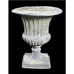 A pair of lead urns of semi-lobed fluted campana form, with everted rim on rising fluted foot and sq