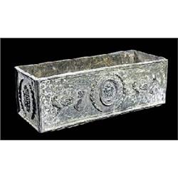 A pair of lead jardinieres, the rectangular side panels moulded with neo-classical style trophy moti
