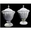 Image 1 : A pair of early 19th century lead urns and covers, the part fluted urns applied with swag moulding a