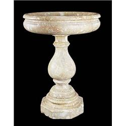 A Continental Alicante Red marble bird bath, the shallow bowl with everted rim, on baluster shaped c
