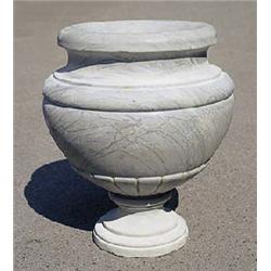 A grey marble urn of semi-lobed form, with everted rim and circular foot, 58 high x 45cm diameter (2