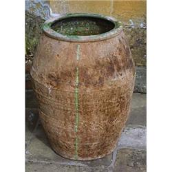 A terracotta baluster shaped storage jar, with green glazed interior and rim, 64 high x 43cm diamete