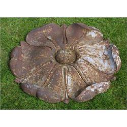 A 19th century cast iron wall plaque, in the form of a Tudor rose, 69cm diameter (27in) £150-200...