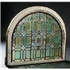 Image 1 : A pair of early 20th century stained glass windows, the central medallion within a geometric panel s