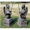 Image 1 : A pair of terracotta gate pier finials in the form of crouching gryphons bearing iron spears, on squ