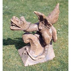A terracotta gable tile, surmounted by a leering gryphon, with wings outstretched and mouth open, 56