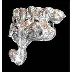 An 18th century Continental carved wood wall bracket, in the form of stylised scrolling foliage, the