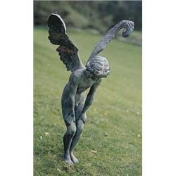 A pair of verdi gris patinated cast iron table supports in the form of winged crouching female nymph