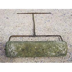 An early 19th century stone lawn roller, with wrought iron T-bar handle, 129 high x 104cm wide (50 1