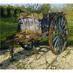 A 19th century French oak hay cart, with enclosed sides and front, and open back, cast iron bound wh