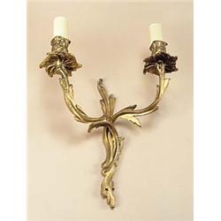 Four brass wall lights, three in rococo style with two branches, 27cm high, the other single branch.