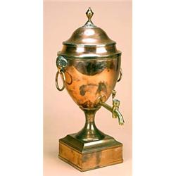 A 19th century copper tea urn, the pierced cover with an urn finial, with rams mask and ring handles