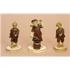 Image 1 : Three Austrian ivory and wood figures of putti, in 19th century style, one as a blacksmith, the othe