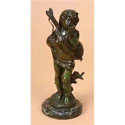 A patinated bronze figure of a child standing wearing a drape with a mandolin slung across his back,