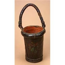 A 19th century leather fire bucket with a leather covered rope handle, painted with an armorial and.