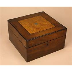 A late Victorian rosewood and ebony strung work box, the hinged top with an amboyna and boxwood trel