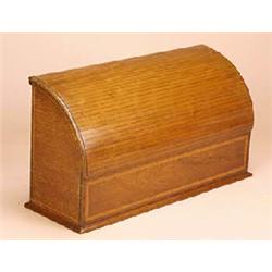 An Edwardian mahogany stationery box, the tambour type cylinder top enclosing recesses, the front sa