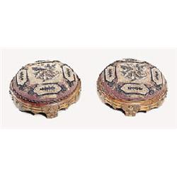 A pair of Victorian walnut round footstools, each with a wool and beadwork top, gilt brass studs and