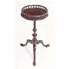 Image 1 : A George III mahogany kettle stand, the round top with a turned spindle gallery, on a spirally flute
