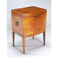 An early 19th century mahogany and boxwood strung bowfronted cellaret, the hinged lid enclosing a ba