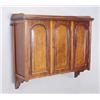 Image 1 : A late Victorian mahogany wall shelf, the three quarter gallery above three doors, with arched panel
