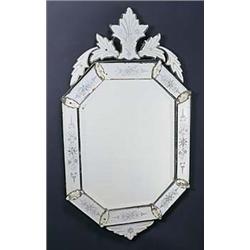 An early 20th century Venetian glass mirror, the mirrored frame engraved with scrolls and flowers, o