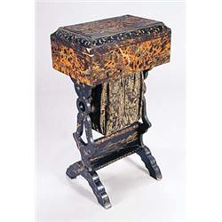 A mid 19th century Oriental tortoiseshell and lacquered work table, decorated overall with landscape