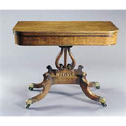 A George IV mahogany card table, the rectangular hinged top with rounded corners, on a lyre support,