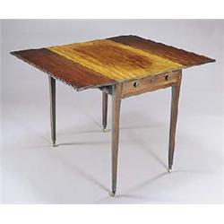 A late George III mahogany Pembroke table, the rectangular top with a moulded edge, with a frieze dr