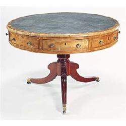 A George IV mahogany drum top library table, crossbanded and with a gilt tooled leather inset, above