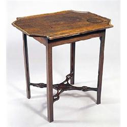 A mahogany table, the rectangular top with an edge moulding and canted outset ends, on a plain friez