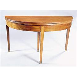 An early 19th century mahogany semi-elliptical table of wide proportions, the hinged folding top wit