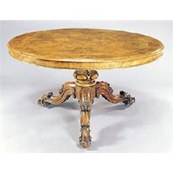 A Victorian burr walnut round breakfast table, the tilt top crossbanded and boxwood strung with radi