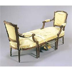 A mahogany duchesse brisee comprising; two elbow chairs and a stool, the reeded mahogany frames with