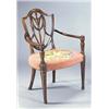 Image 1 : A mahogany shield back elbow chair with pierced and interlaced back, a woolwork upholstered seat and