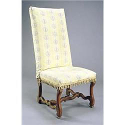 A French side chair, the tall back and seat upholstered in printed cotton, the walnut shaped legs wi