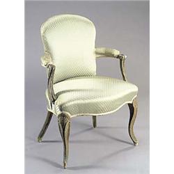 An early 20th century French painted open armchair, with an upholstered back, seat and arms, with sc