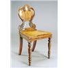 Image 1 : A William IV yew hall chair, the shield shaped back on foliate scroll supports with a solid seat, on