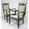 Image 1 : A pair of mid 19th century Anglo Indian ebony open armchairs, each carved overall with stylized flow