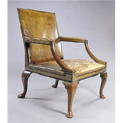 A mahogany Gainsborough chair in George III style, with a rectangular upholstered back, seat and arm