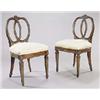 Image 1 : A pair of late 19th century North European ash and parcel gilt side chairs each with a carved crest.