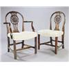 Image 1 : A set of eight mahogany dining chairs in George III style, each with a hoop back and patera carved a
